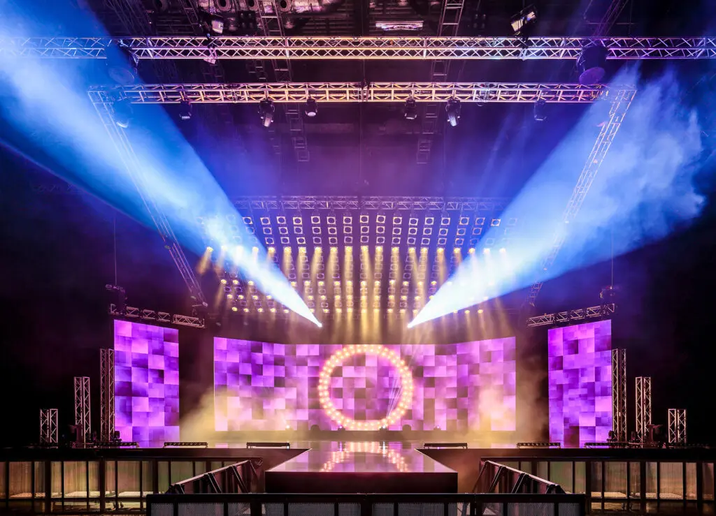 An LED video wall and lighting on stage.
